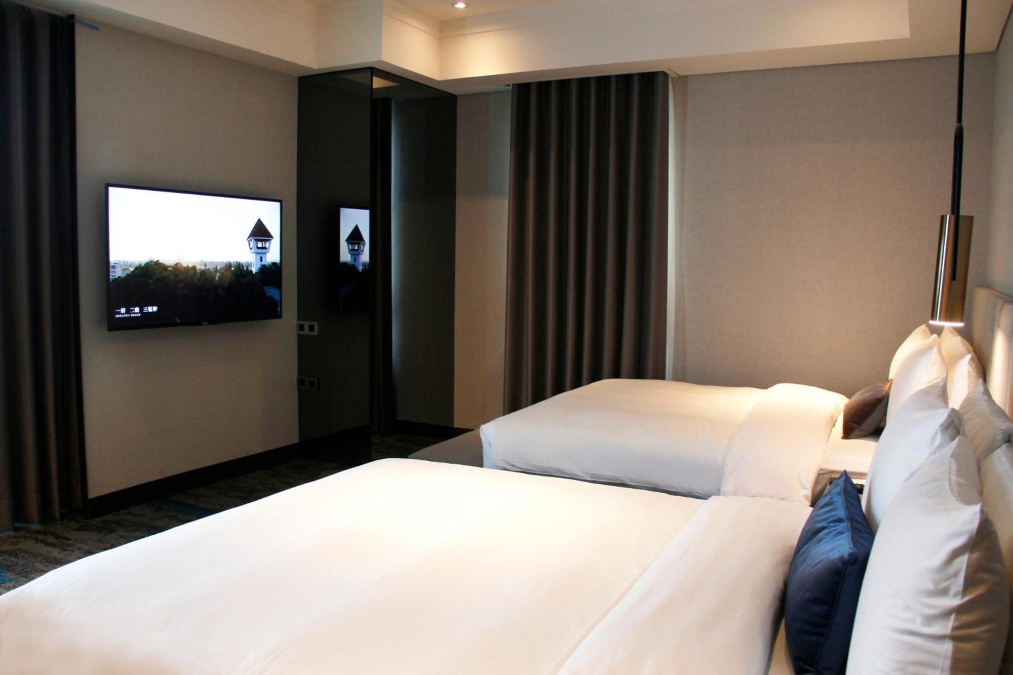 טאינאן Queena Plaza Hotel מראה חיצוני תמונה